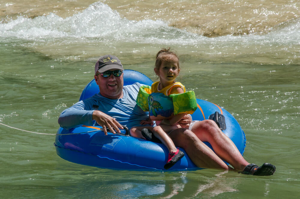 Dad with his son enjoying his Father's Day gift, a Frio River getaway.