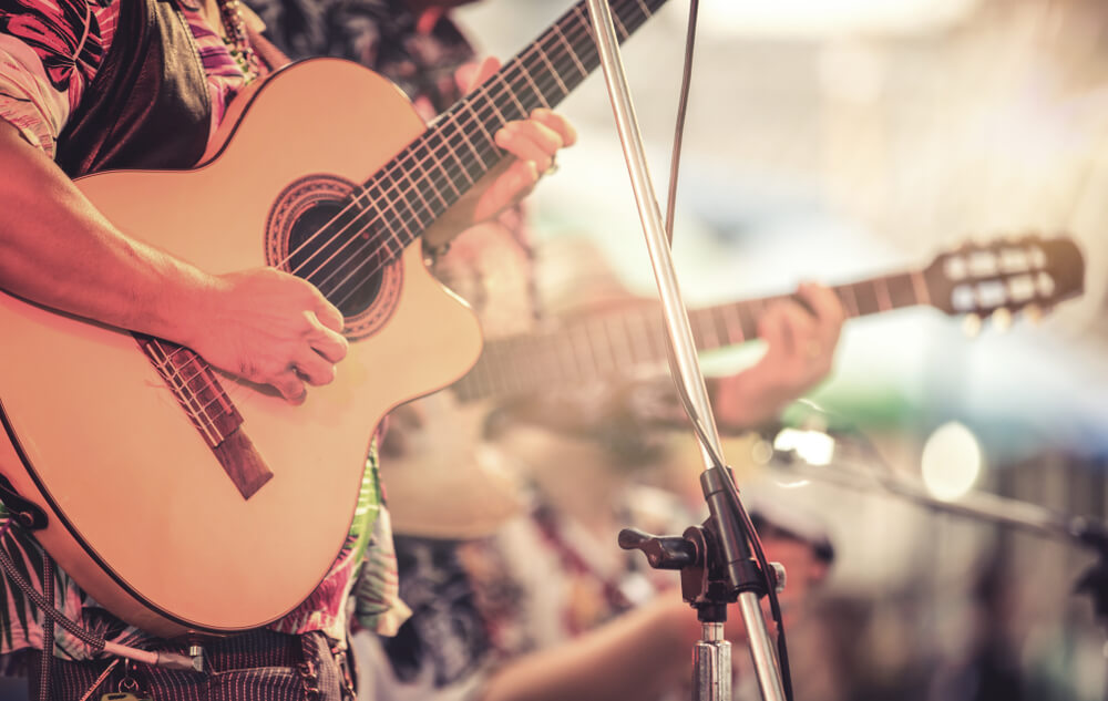 Your Guide to Live Music in the Texas Hill Country Your Guide to Live Music in the Texas Hill Country: A close up of a man playing a guitar