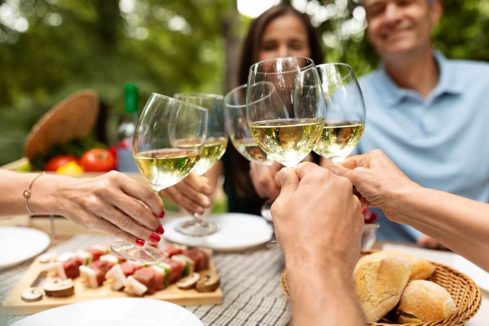 Sip Your Way Through Texas Hill Country Wineries: A group of friends are enjoying wine